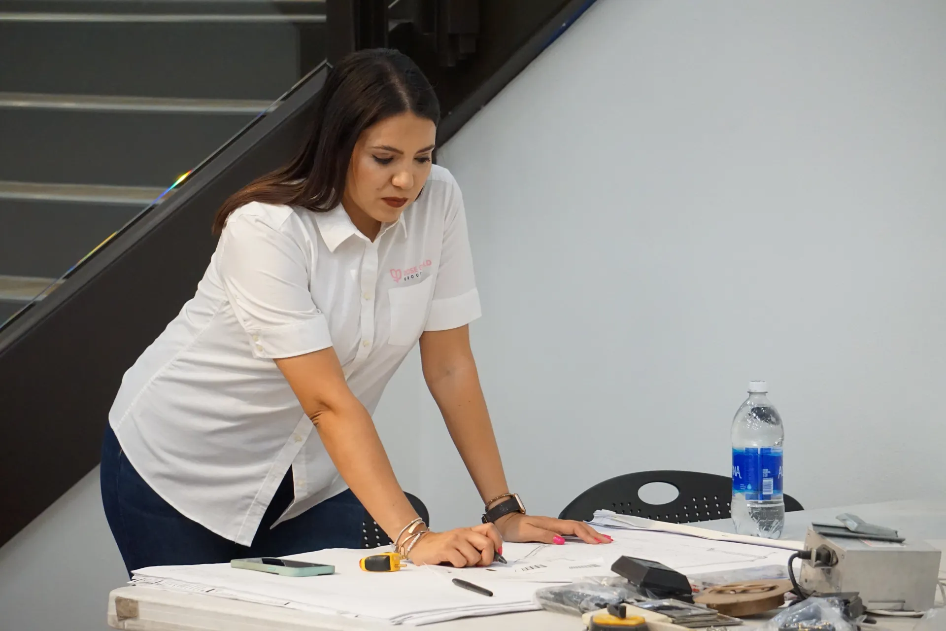 Nayeli Meza reviewing blueprints